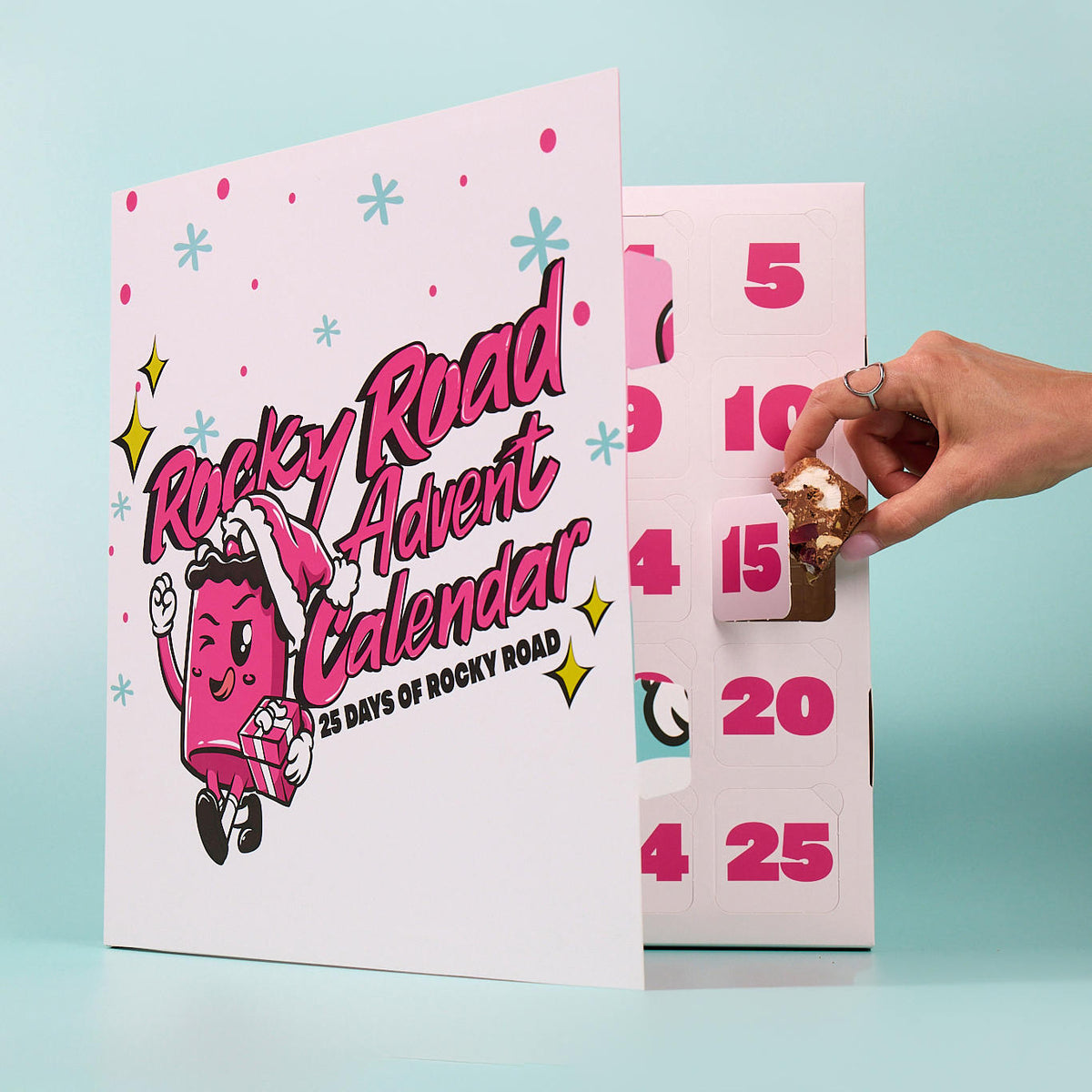 Custom printed pink and white advent calendar box with an open numbered door against a pale blue background