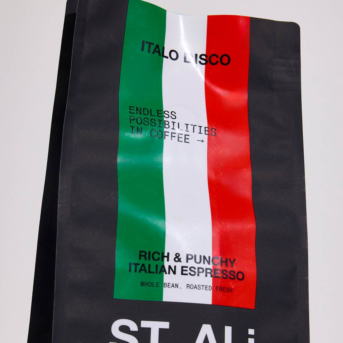 Matte black stand-up pouch printed with a glossy green, white, and red Italian flag design and text